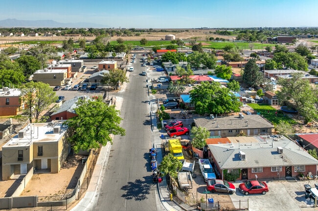 The grid-ordered residential streets of Trumbull Village are generally lined with Midcentury ranch-style and Pueblo Revival style homes.