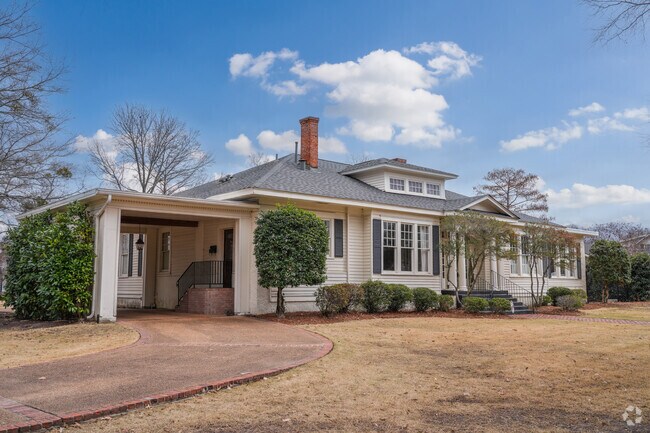 This Craftsman Bungalow in Greenwood highlights early 20th-century design with its low-pitched roof, wide eaves, and inviting front porch.