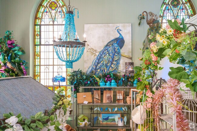 Take a look at this peacock painting as you shop inside The Jeweled Bird.