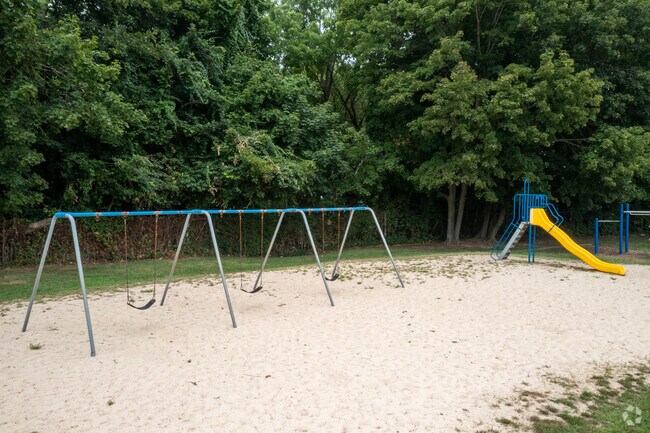 Woodhull Intermediate School features a swing set for the students to enjoy in Huntington, NY.