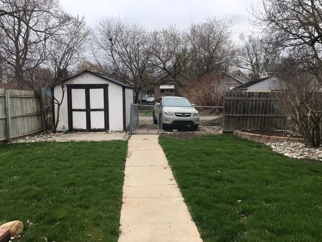 Storage shed and 2 dedicated parking spots off alley