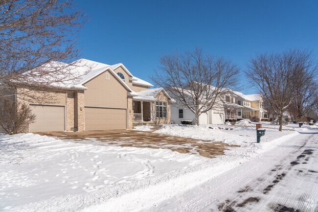 Newer contemporary homes with brick and siding are common in the Shonas Highlands neighborhood.