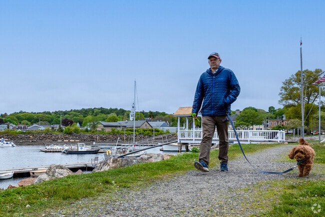 Dog walkers enjoy access to sweeping views of the water in many areas of Manchester by the Sea