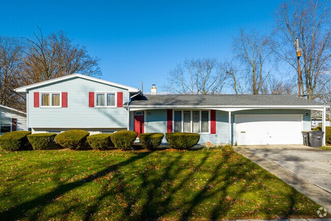 A split-level home with a large lot and a two car garage in Morningside-Terrace.