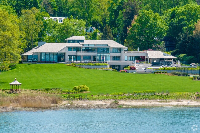 This modern mansion sits on the shores of Oyster Bay Cove.