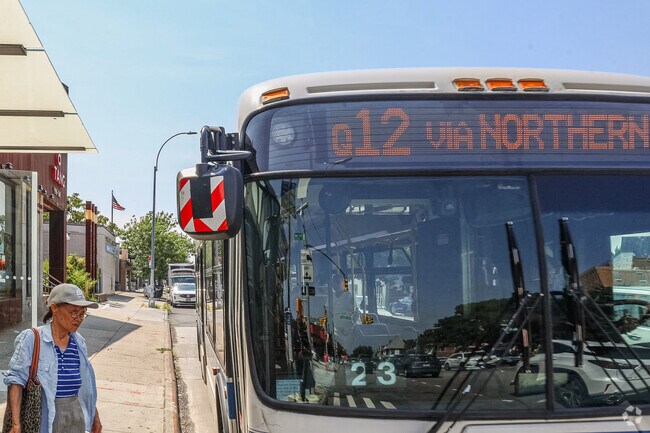 Auburndale's Northern Boulevard has a continuous flow of MTA buses like the Q12.