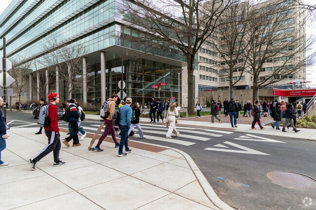 Temple students walk between classes in the Hartranft neighborhood.