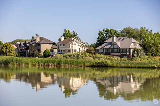 Neighborhood homes reflect beautifully along the borders of Longmont Estates.