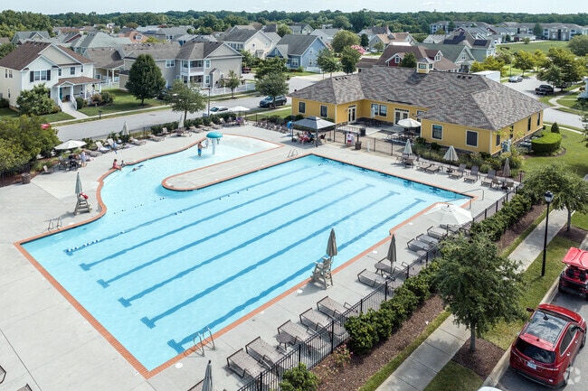 Swim laps and relax in the expansive seating area at the community pool in Culpepper Landing.