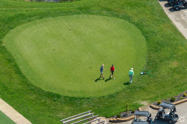 Quail Hollow Country Club's putting green is a hot spot on sunny days.