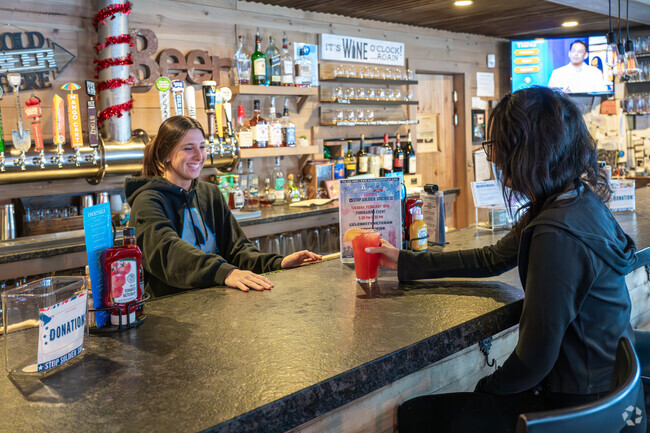 Mina residents embrace the warm atmosphere and service with a smile at Alexander's in Mina.