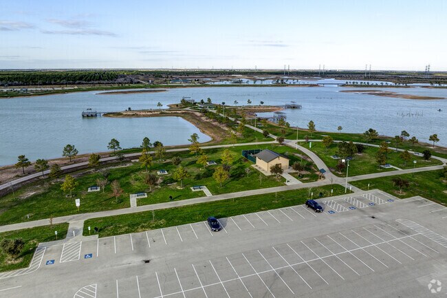 John Paul Landing Park spans 30 acres and features trails, lakes, and lush greenery.
