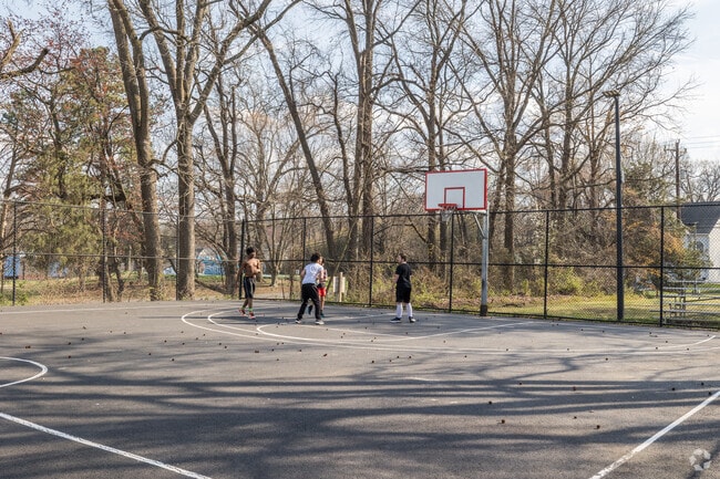 Ginn Memorial Park in River Oaks features basketball courts for friendly games.