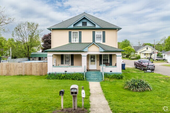 A classic American Foursquare-style home stands proudly in Plaza North-Highland neighborhood.