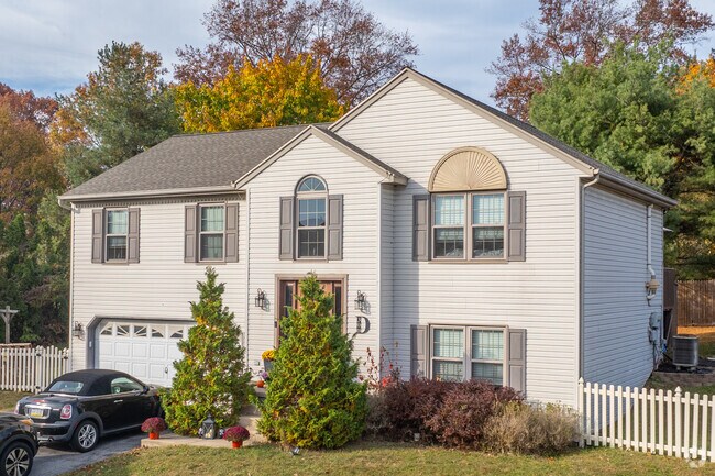2 story new traditional homes are shaded by East Hanover nature and trees.