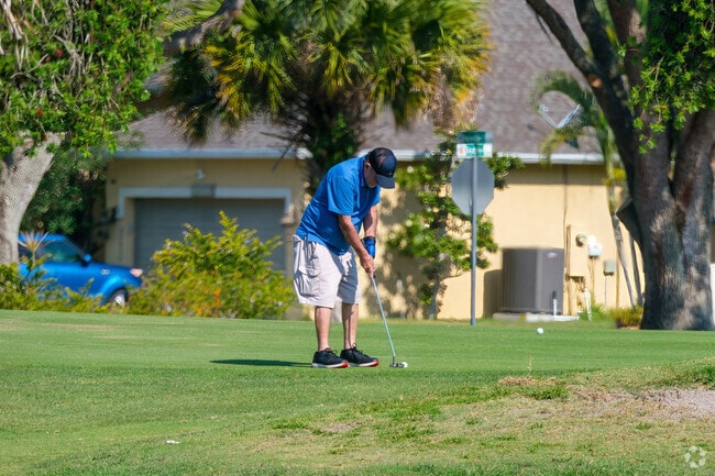A Wedgefield local concentrates on his putt at the Wedgefield Golf Course.
