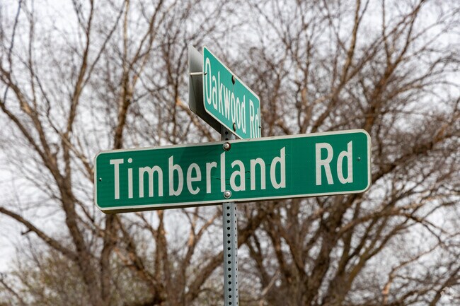Timberland Road is broadly split between lush wooded lots and new housing developments.