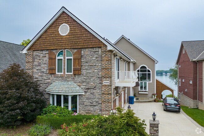 Magnificent lakefront home with incredible unobstructed sunset views on White Lake.