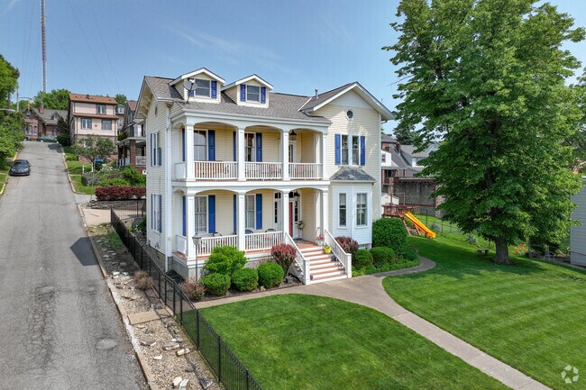 A big, beautiful home with two porches and a large yard, in Fineview.