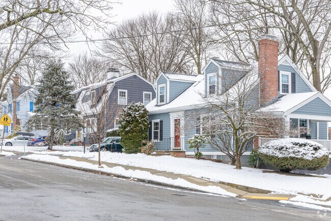 A row of homes featuring a Cape Cod styled home in the Arlington Heights neighborhood.