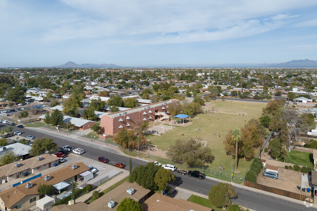 Students have access to a large field and play areas at Edison Elementary in Mesa.