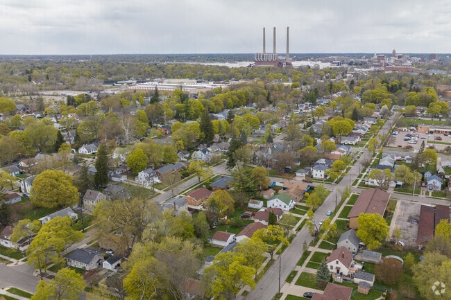 Aerial view of residential streets in Greencroft Park with downtown Lansing in the background.
