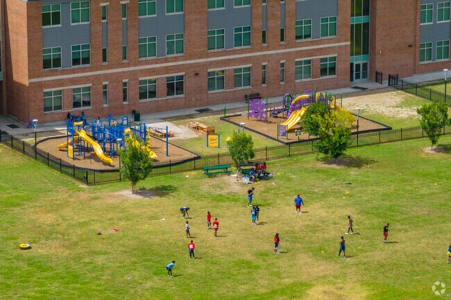 Kids play flag football in the green space at KIPP Morial in New Orleans.