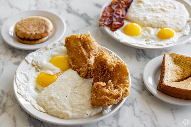 Visit The Breakfast Place in Gordonston for fish and grits, a classic Savannah breakfast.