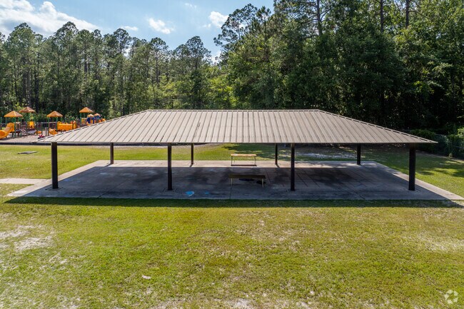 Students get a break from the sun under the pavilion at Mamie Agnes Jones Elementary School.
