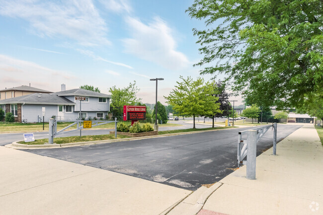 Entrance to the parking lot and school leading from Bloomingdale Rd.
