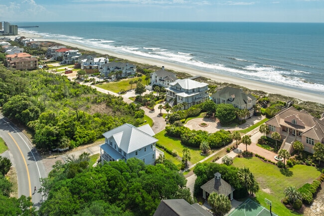 Grande Dunes oceanfront homes line the scenic coastline near premier resort amenities.