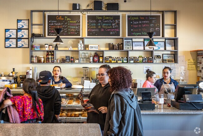 Customers at Small Town Cafe and Bakery in Dunellen, NJ, place orders and peruse the menu.