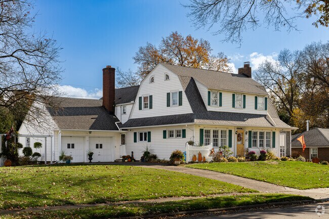 A two-story mid 20th century home sits back from the road in Downtown Massillon.