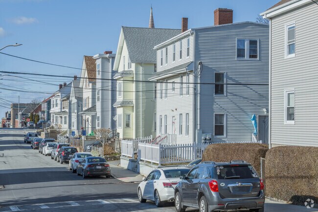 Extended multi-generational families are common among the triple-deckers of Bank Street.