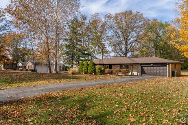 Mid-century ranch homes are nestled spacious yards with shade in Mount Comfort.