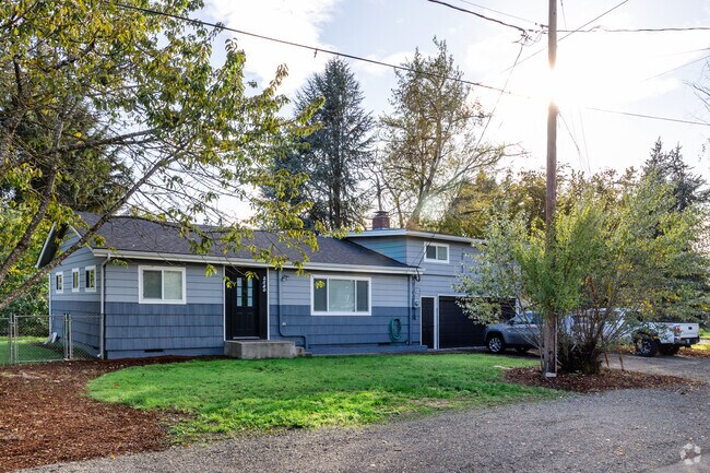 Ranch-style home with shady trees can be found in Trainsong.