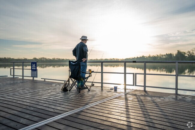 A fisherman casts a line at Lake Friendswood Park in Friendswood.