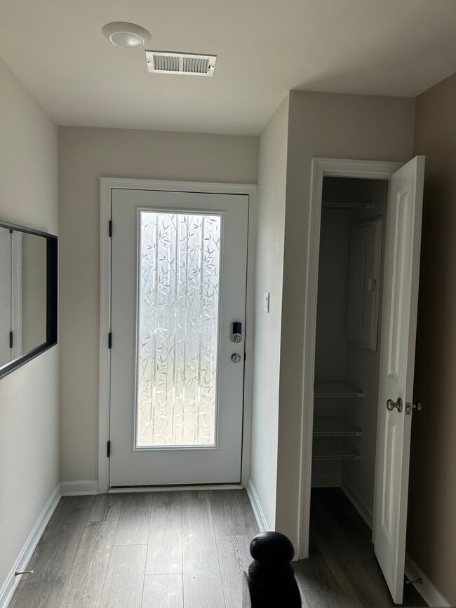 Front door & coat closet