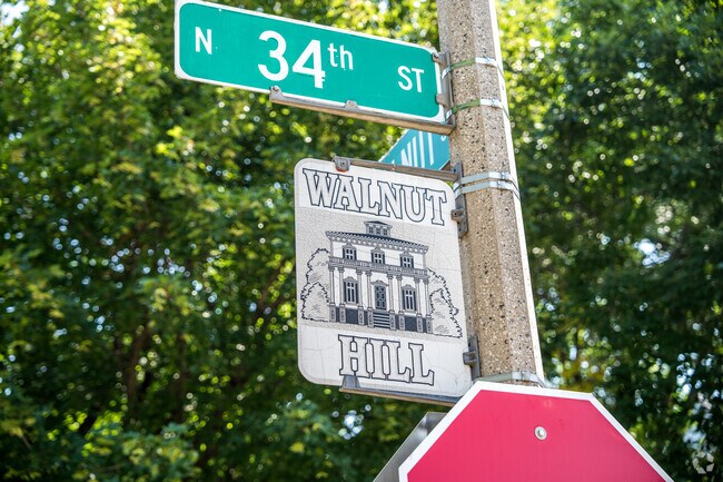 The neighborhood of Walnut Hill welcomes people with street signs along the borders.