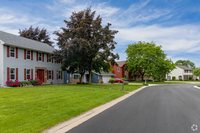 New Traditional and Colonial homes line the quiet, tree-filled streets of Fox Crossing.