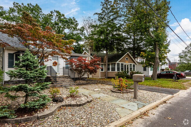 These homes have great landscaping with rocks as a theme in Pine Beach, NJ.