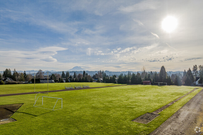 Athletic field with views of Mt. Ranier and sunny skies.