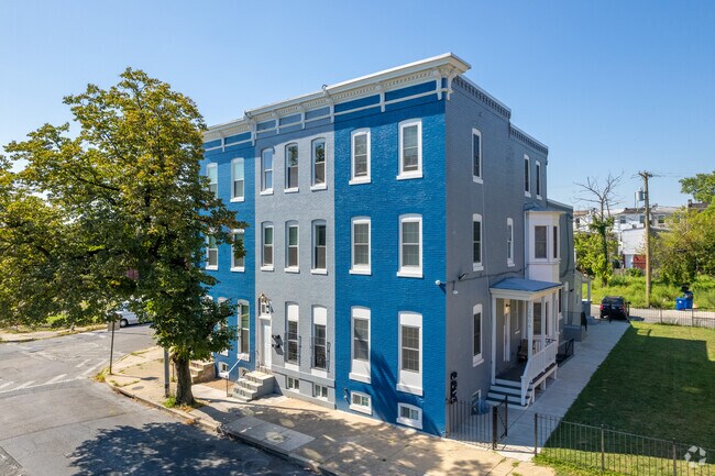 Even some newer rowhomes can be found in Penn North like this blue and grey triplex.