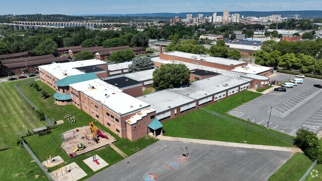 Foose School offers a basketball court and playground set for student's to enjoy.