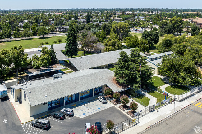 Tall trees stand on the campus of Robinson Elementary School in Fresno.