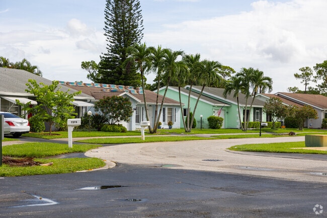 Colorful single family homes line up on the streets of the Lucerne Lakes neighborhood.