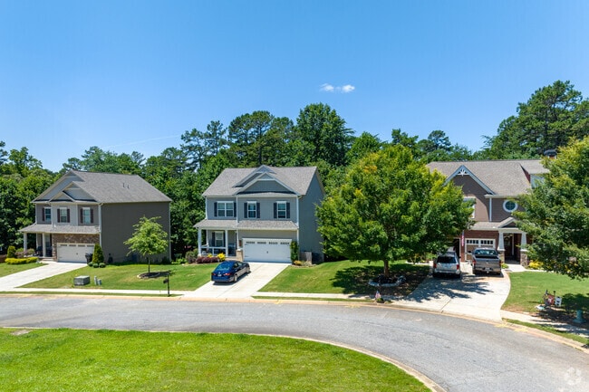Homes in this subdivision in Dawsonville feature the farmhouse style.