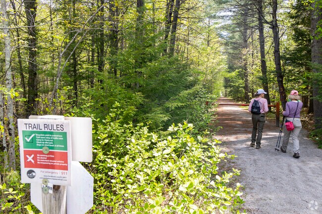 The Concord Rail Trail offers a scenic route for walking, biking, and connecting with nature through quiet woodlands and open views.