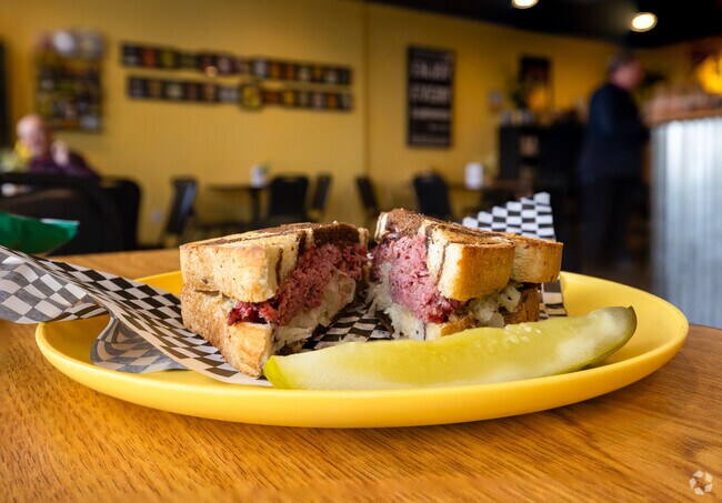 Try Colonel Mustard's Sandwich Emporium's famous pastrami sandwich it's in Gold Hill Mesa.