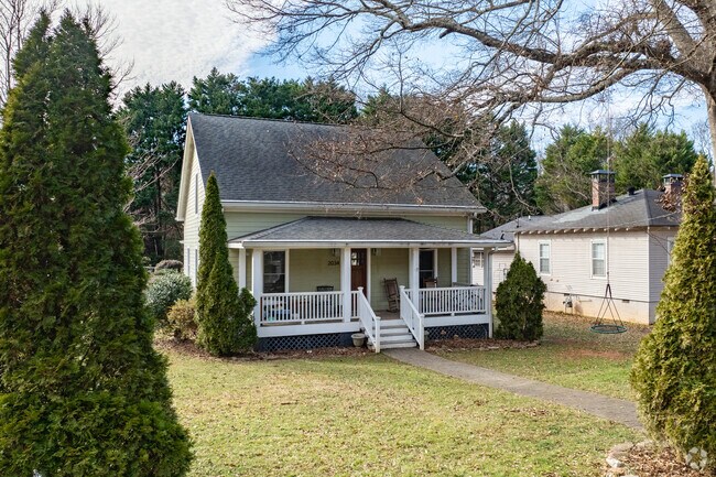 Whittier Mill Village homes often showcase historic details like sloped roofs & wood siding